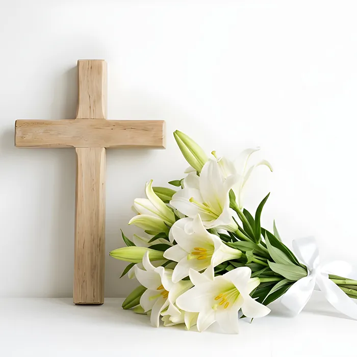 Holzkreuz mit Blumenstrauß